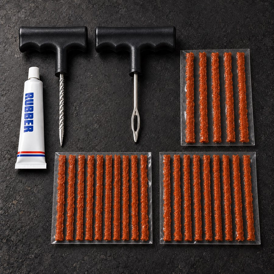 RoadReady tire repair kit contents with two T-handle tools, rubber cement and 25 repair strips